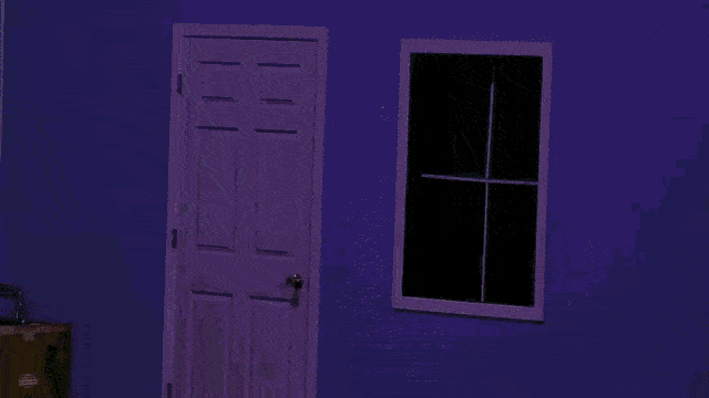 Shark/Dog creature jumping through a window on a stage